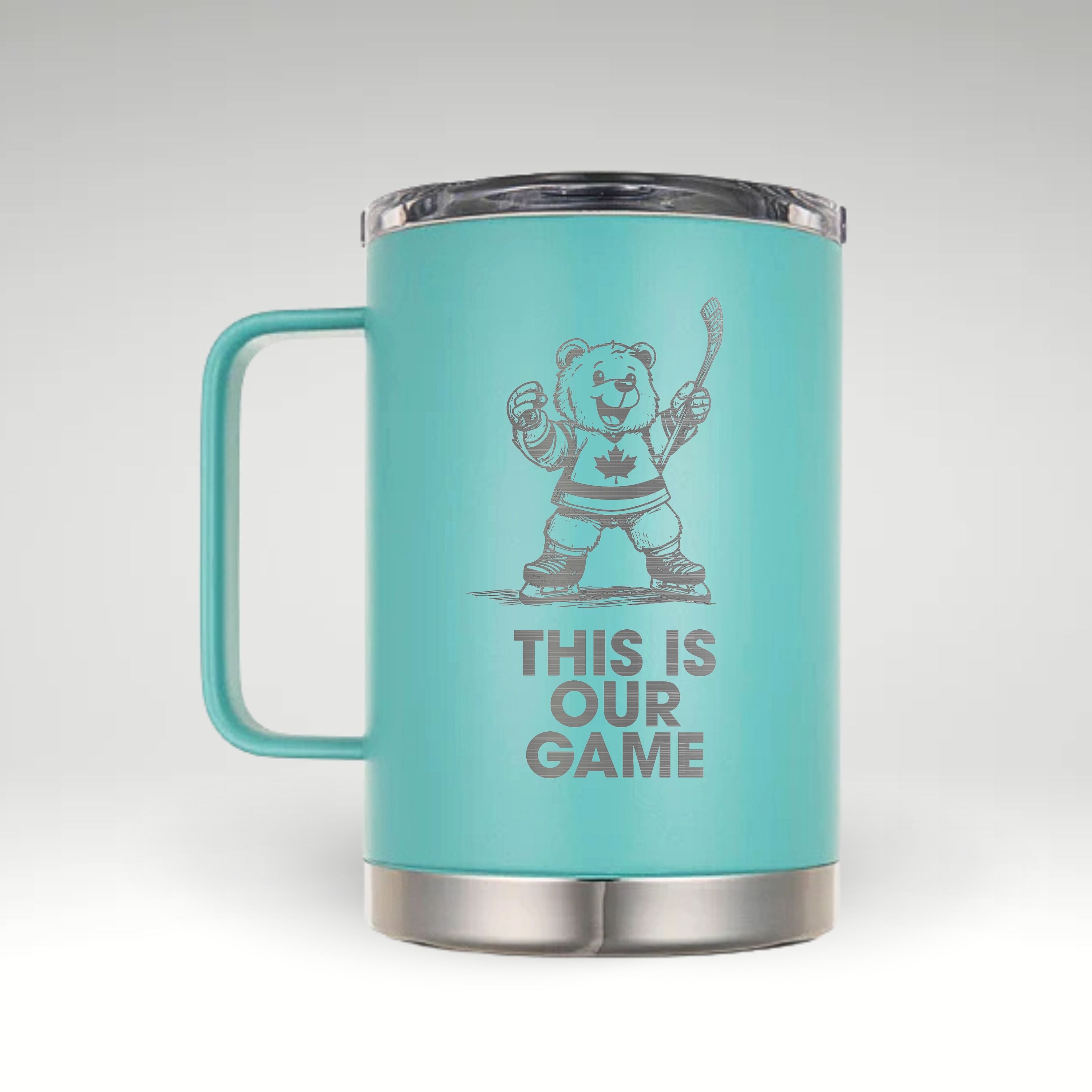 Turquoise insulated mug with an engraved design of a cheerful hockey bear in a Canadian jersey holding a hockey stick, with the text "THIS IS OUR GAME" below. #color_turquoise