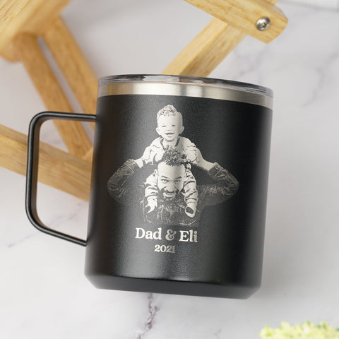 LAMOSE Black insulated Mug with engraved image of a father holding a baby and the text, perfect for personalized Father's Day gifts.