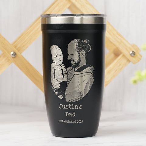 LAMOSE Black insulated tumbler with engraved image of a father holding a baby and the text, perfect for personalized Father's Day gifts.