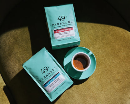 Old School Espresso by 49th Parallel Coffee Roasters. A medium-dark roast with flavors of caramel, dark chocolate, and nuts. Crafted from Indian Ratnagiri Estate and Colombian Tolima Organic beans for a rich and comforting espresso experience.