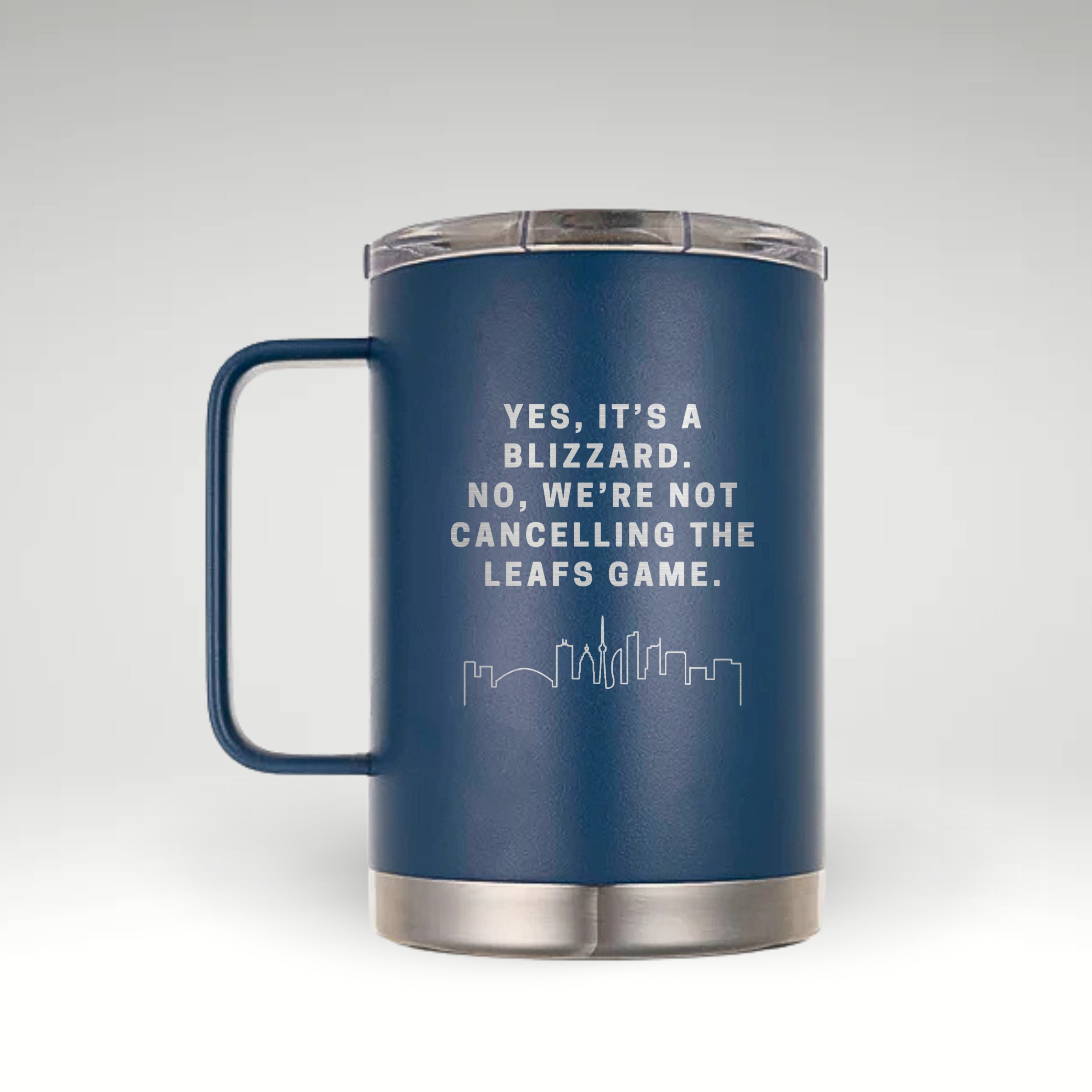 Classic Blue insulated mug with handle, featuring an engraved Toronto skyline and the phrase "Yes, it’s a blizzard. No, we’re not cancelling the Leafs game." Stainless steel bottom and clear lid.  #color_classic-blue