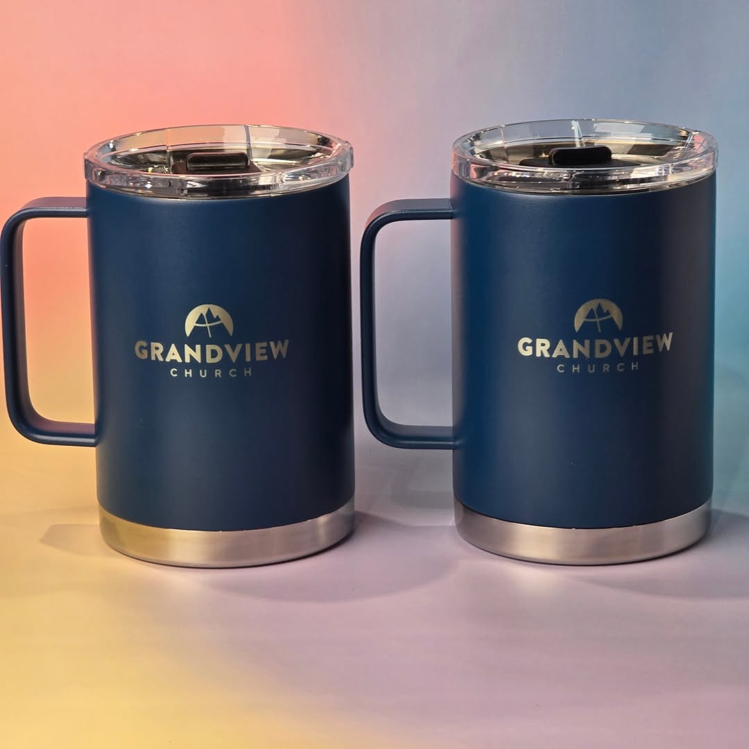  Two navy blue insulated mugs with stainless steel accents and ‘Grandview Church’ logo engraving. 