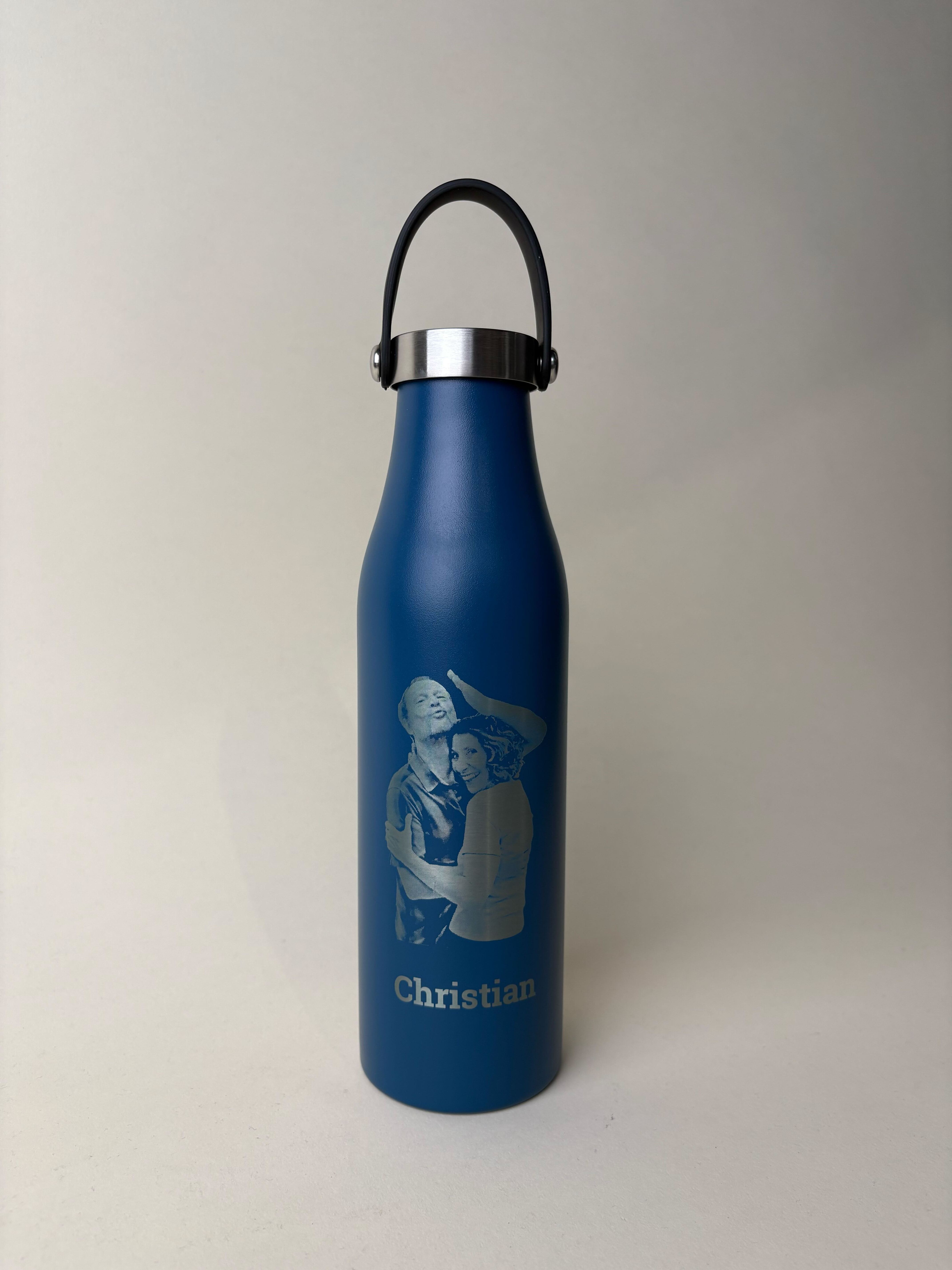 Personalized engraved water bottle – navy blue stainless steel with custom photo engraving and the name 'Christian' etched below. Insulated bottle with handle, perfect for gifts, keepsakes, and custom drinkware. Ideal for personalized hydration and unique laser-engraved designs.