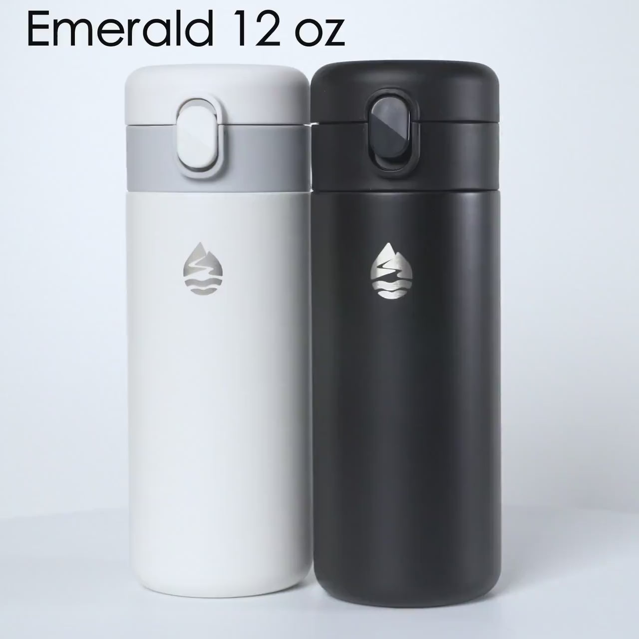 Load video: Lamose Emerald 12 oz insulated travel mugs in sleek black and white, featuring a spill-proof flip lid and engraved water drop logo. Perfect for keeping beverages hot or cold on the go.