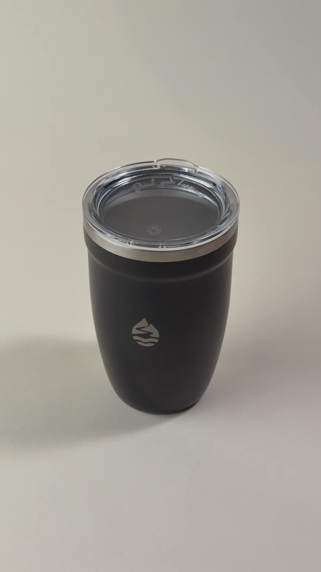 Load video: Black insulated tumbler with a clear spill-resistant lid. Sleek stainless steel travel mug designed to keep beverages hot or cold for extended hours.