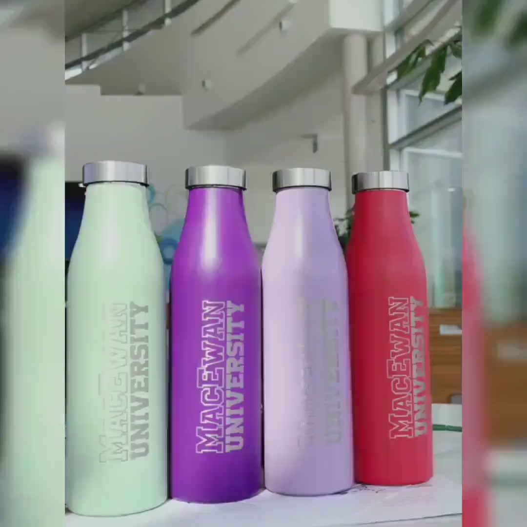 Load video: Set of four colorful stainless steel water bottles featuring &#39;MacEwan University&#39; engraving, arranged in a row with pastel green, deep purple, lavender, and bold red finishes.